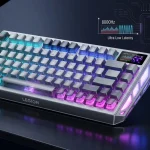 A professional product photograph of the Lenovo Legion R7 RT75 75% wireless mechanical gaming keyboard. The keyboard, in its Cloud Silver color, displays its dynamic RGB lighting, integrated 1.4-inch TFT display screen, and textured spacebar, set against a dark background with projected geometric patterns.