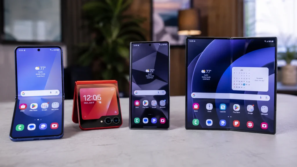 A comparison of current and older Samsung foldable phones, featuring the Galaxy Z Fold 8 displayed fully opened next to older Flip and Fold generations on a table.