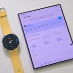 Samsung Galaxy Watch9 in yellow alongside a foldable smartphone displaying the Heart Health score dashboard.