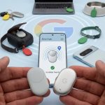 Hands holding two new Google Pixel Tag Bluetooth trackers, showing the silver one with a prominent 'G' logo, alongside a smartphone displaying the 'Find Hub' app. The background is a flat lay of diverse objects like keys, a passport, and a pet bowl, all featuring colorful Google Pixel Tag attachments, illustrating widespread item tracking.